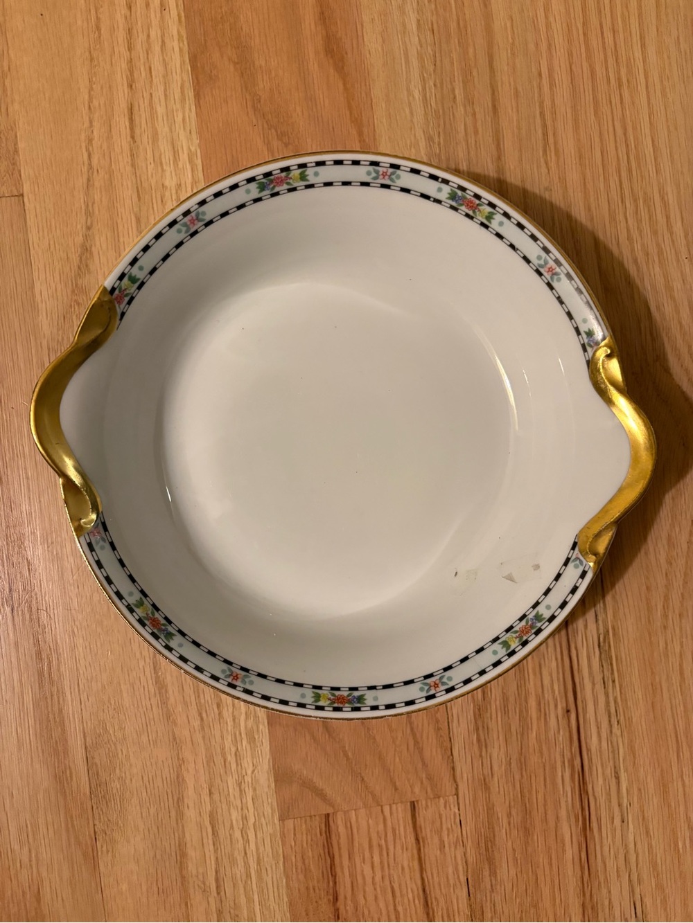 White Ceramic Serving Bowl with Gold Handles and Floral Trim